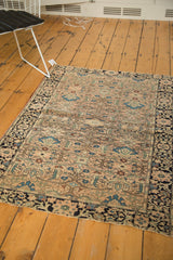 Detailed antique Farahan Sarouk rug with tree-of-life motifs, dusty rose, ivory, and navy border.