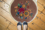 Antique Chinese Art Deco rug showcasing oversized fuchsia and gold lotus flowers, ornate multi-color florals on beige.