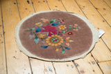 Plain weave perimeter and even pile showing colorful Art Deco floral motifs.