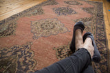 Distressed vintage Sparta runner featuring faded apricot field and ornate blue medallions.