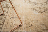 Hand-knotted vintage Oushak carpet showing distressed pile and exposed foundation.