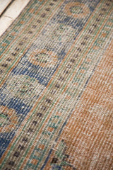 Distressed vintage Oushak carpet, with even wear, faded royal blue and dusty apricot tones.