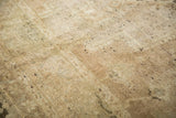 Distressed hand-knotted pile texture of a vintage Oushak rug, with beige and charcoal flecks.