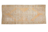 Vintage distressed Oushak runner, saffron gold double serrated medallion, rhythmic corner spandrels, 3'10
