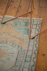 Distressed vintage Oushak runner pile with even wear, knot heads, and faded peach, mint.