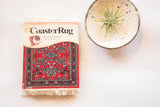 Deep red Bijar CoasterRug set features allover intricate blue and green floral pattern, 3.5x4.25 inches.