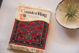 Bijar Deep Red CoasterRug set in packaging, featuring allover pattern on deep red field.