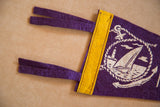 Purple felt ties and yellow stitched band of the Manasquan pennant.