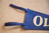 Deep blue felt Olvera Street flag with precisely slotted ties and cream 