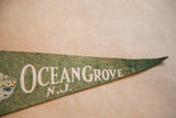 Vintage green felt Ocean Grove NJ pennant tip with white lettering detail.