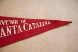 Red felt Santa Catalina pennant tip with white text and visible wear.