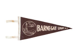 Vintage 1950s dark brown Barnegat Light NJ felt flag with white lighthouse graphic.
