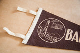 Dark brown felt pennant with visible Barnegat Light graphic and cream border.