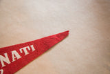 Worn red felt tip with white lettering detail from the Cincinnati Ohio pennant.
