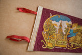 Close-up of Philadelphia felt pennant's cream binding, red ties, and Independence Hall graphic.