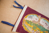 Detail of 1960s Nashville felt flag, showing blue ties and cream border.