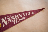 Vintage maroon felt pennant tip with light creasing and white 'Nashville Tenn.' text.