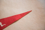 Red felt pointed tip of the New York Statue of Liberty pennant.