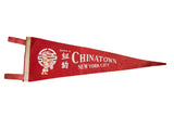 Souvenir of Chinatown NYC felt flag, red with girl, lantern, and Chinese characters.