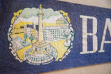 Textured dark blue felt Baltimore pennant with white 'BA' letters and light creasing.