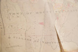 Torn cream paper and red markings on a vintage 1930s Hopkins Mount Pleasant map.
