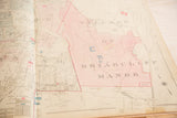 Vintage 1930s Hopkins map of Briarcliff Manor, featuring softened tones and paper fold.