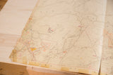 Aged 1930s Hopkins map section, showing roads, text, and visible tape repairs.