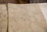 Vintage Hopkins map detail, showing center rip, handwritten numbers, and aged paper texture.