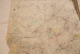 Vintage New Castle map lower section, dense streets, red and green markings, visible wear.