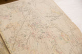 Vintage Hopkins map with aged paper texture, faint grid lines, and handwritten details.