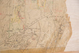 Aged 1930s Hopkins map section, detailing roads, land divisions, and a torn right edge.