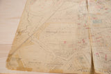 Vintage Hopkins map of Mt Kisco, highlighting prominent central fold and detailed village layout.