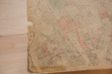 Torn left edge and faint street details on the vintage Mt Kisco town map.