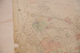 Beige 1930s Hopkins Mt Kisco map detail with a noticeable ripped corner.