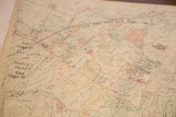 Aged beige paper of the vintage 1930s Hopkins map with creases and faded markings.