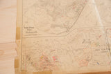 Detailed view of vintage Hopkins map's aged left edge, showing Katonah area and visible tears.