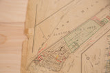 Aged 1930s Hopkins map section showing Bedford property names and compass rose.