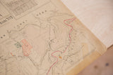 Folded top corner of the 1930s Hopkins map, highlighting aged paper and copyright text.