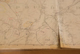 Vintage Hopkins map, showing a long central rip and a distressed, folded right edge.