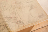 Vintage 1930s Hopkins map corner detail, showing aged paper with a soft crease.