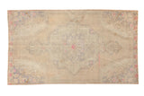 Distressed Oushak rug, faded center medallion, muted dusty beige, blue-grey, and pink tones. 4x7.