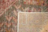 Distressed Oushak rug pile, visible foundation, intact side cord, and woven reverse.