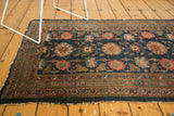 End of antique Lilihan rug, hard tatter, repeating triple column medallions in indigo, raspberry, blush.