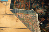 Hand-knotted foundation and tattered fringe of the antique Lilihan rug runner.