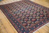 Angled perspective of a fine Persian Malayer rug, displaying the allover geometric veramin motif.