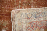 Time-softened cinnabar red distressed Oushak pile, showing hand-knotted reverse.