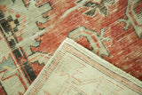 Distressed vintage Oushak runner corner, revealing faded cherry red pile and hand-knotted beige foundation.