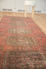 Distressed Oushak runner close-up, showing faded rectilinear gul motifs with visible foundation.