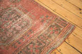 Textural wear on the secured corner of a distressed vintage Oushak rug runner.