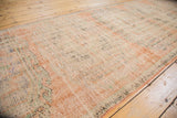 Distressed vintage Turkish Oushak runner showing low pile texture with pale terra cotta and varied tones.